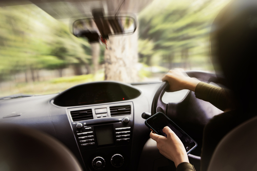 common causes of car accidents in Cumming Georgia, automobile swerving due to distracted driving in Georgia. 