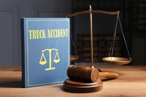 gavel, scale, and book about truck accidents