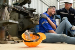 Injured manufacturing worker on factory floor in Atlanta seeking workers compensation benefits