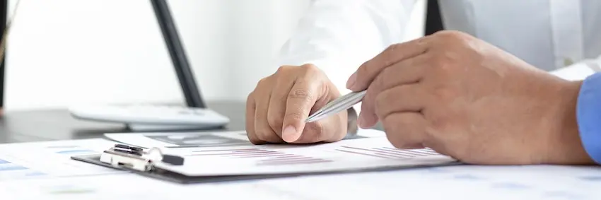 Georgia workers compensation claim paperwork for an Alpharetta manufacturing injury being reviewed by a workers comp lawyer