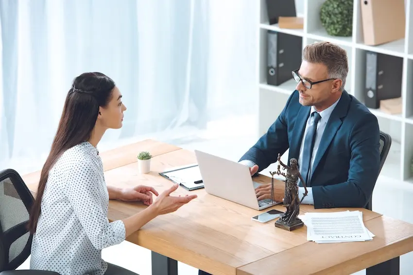 Alpharetta workers' compensation lawyer consulting with injured healthcare professional about Georgia workers' comp claim