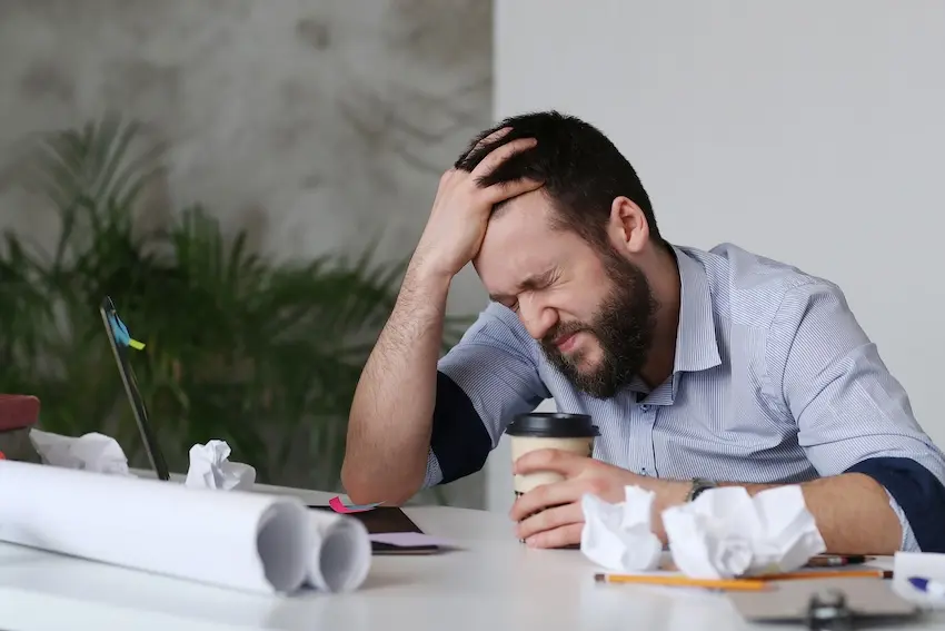 Injured Georgia manufacturing worker at home dealing with medical bills and a workers compensation claim