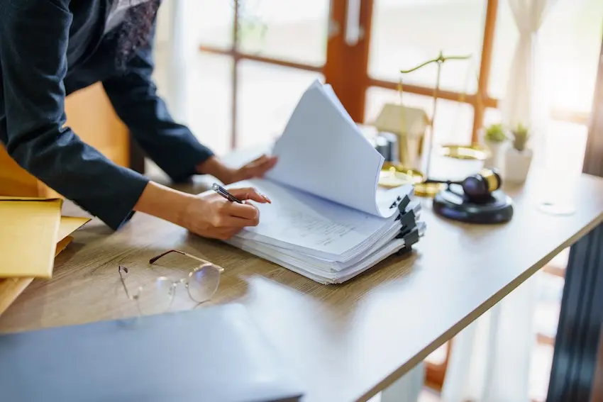 Insurance adjuster reviewing a construction workers' compensation claim in Georgia — why injured workers need an experienced lawyer before signing anything