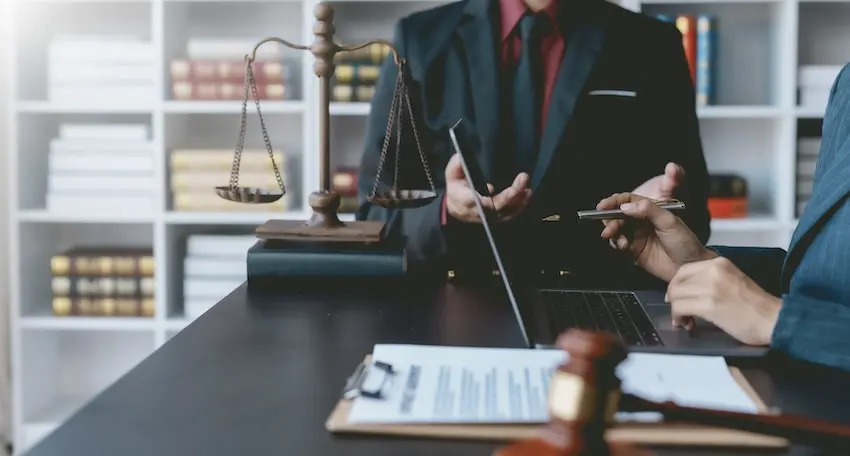 An injured worker meeting with a workers' compensation attorney in Atlanta, Georgia to review their claim options