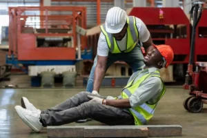 Injured manufacturing worker on factory floor considering workers compensation claim in Georgia