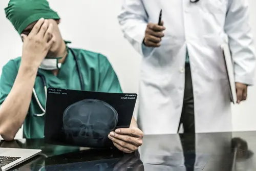 Doctor Looking At Scans