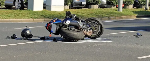 Scene of a motorcycle accident where the victim will need legal representation from a motorcycle accident lawyer.